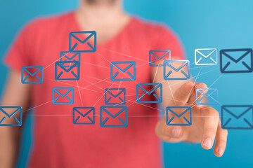 Person interacts with a network of email icons, representing communication and connectivity.