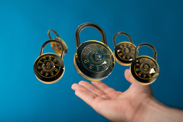 Poster - Safeguarding information: Multiple combination locks floating above a hand, symbolizing digital security and data protection.