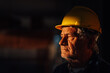 © Ljustina - Senior construction worker wearing yellow hardhat contemplating project