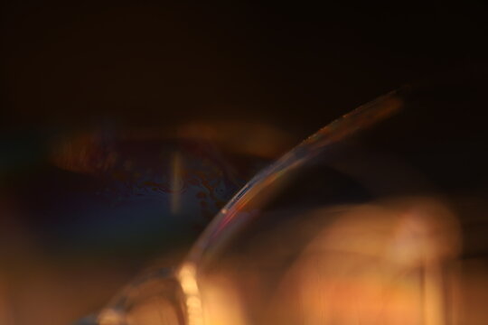 Green liquid surface, green Reflections of liquid in macro,, bubbles in macro, connection of bubbles in macro, cell from liquid, dark background, glossy surface