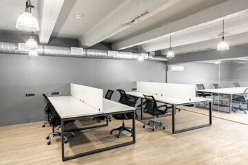 Poster - Modern office workspace with sleek furniture and minimalistic design in urban setting