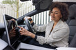 © ReeldealHD images - Woman interacing with a car's touchscreen dashboard