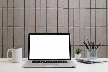 Aufkleber - Stylish home office desk with laptop, writing tools, and minimalist decor elements.
