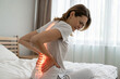 © Dini-Pixels - woman with back lumbar pain from bad night sleep