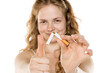 © vladimirfloyd - Young woman breaking cigarette in half, smiling confidently. Symbolizing quitting smoking, health awareness, and personal triumph over addiction