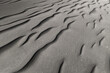 © ADDICTIVE STOCK - Detailed black sand textures shaped by natural elements