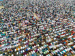 © AmazingAerialAgency - Aerial view of a large gathering of people in prayer during Eid al-Fitr, Sher-e-Bangla Nagar, Dhaka, Bangladesh.