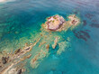 © AmazingAerialAgency - Aerial view of Aphrodite Beach with clear turquoise water and serene coastline, Chrysochou Bay, Neo Chorio, Paphos, Cyprus.
