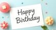 © MDSajid - Happy Birthday Card with Pastel Flowers and Candies on Light Blue Background Celebration Still Life