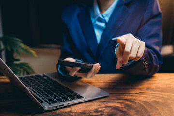 Poster - Business Professional Engaging with Laptop and Smartphone in Modern Office Environment