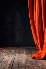 Poster - Moody Studio Shot of Orange Curtain Against Black Backdrop on Rustic Wood Floor Dramatic Lighting