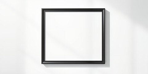 Poster - A black framed blank canvas hanging on a white wall with a subtle shadow on the right side
