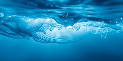 Poster - A view from underwater showing the surface of the water with sunlight streaming through it softly