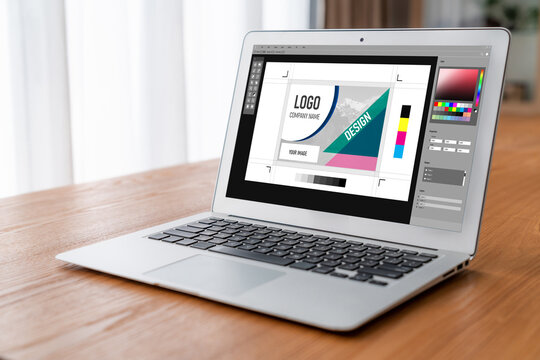 Graphic designer software for modern design of web page and commercial ads showing on the computer screen