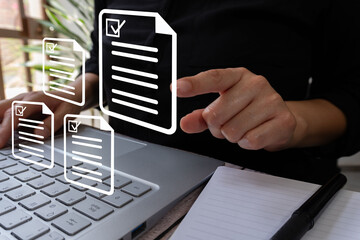 Poster - A person touching an icon of a document, multiple documents floating around in the background with check marks next to each one, and another hand holding up a pen near a computer keyboard