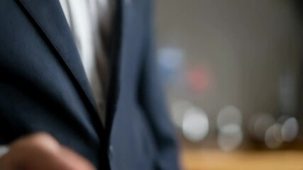 Poster - Man in suit holding smartphone with digital warning sign hovering above it in a blurred setting