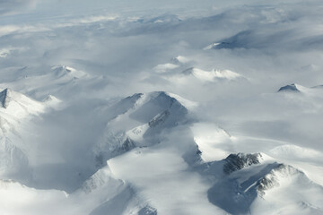 Wall Mural - Aerial view of mountain and fog in Antarctica.