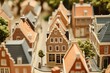 © masud - Miniature traditional Dutch canal houses, narrow streets and brick buildings, detailed model town