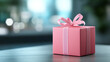 © sumet - A beautifully wrapped pink gift box with a ribbon, symbolizing celebration and joy in a soft-focus environment.