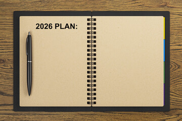Aufkleber - Blank 2026 planner notebook with pen on wooden desk top view background for business or personal organization and productivity concept.. 3D Rendering