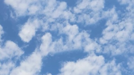 Poster - Sky's Whispers: A captivating photograph captures the airy dance of clouds across a vivid azure canvas, evoking a sense of peace and wonder.
