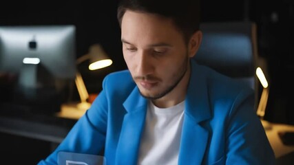 Poster - Person typing on a keyboard with loading documents graphic overlay and blue jacket on a desk