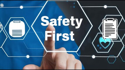 Poster - A man in a blue shirt pointing at a safety first graphic with various icons on a dark background