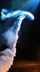 Poster - Abstract smoke formation against dark background with blue and orange stage lighting for a dramatic effect in studio shot