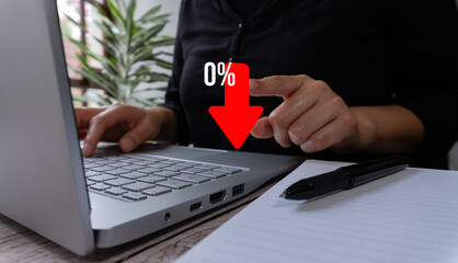 Poster - A person types on his laptop and points to a red arrow pointing down and the text 