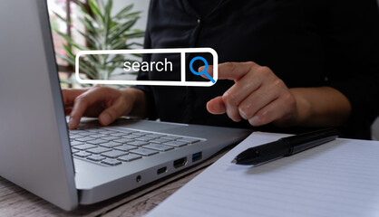 Poster - A person typing on their laptop points to the word 