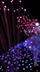 Poster - Abstract arrangement of optical fiber lamp, illuminating colorful dots with pink, purple, and blue hues in a futuristic display on a black background.