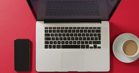 Poster - overhead view of laptop with smartphone and coffee on red desk