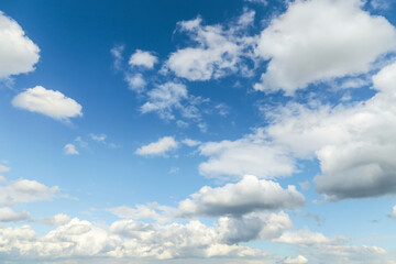 Wall Mural - Blue sky with white cumulus fluffy clouds background texture