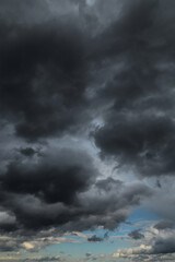 Wall Mural - Epic Dramatic Storm sky with dark cumulus rainy clouds against blue sky abstract background texture, thunderstorm