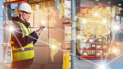 Poster - Man in warehouse delivery service. Employee international logistics company. Worker warehouse courier company. Guy monitors global supply chains. Man in yellow vest in warehouse industrial building