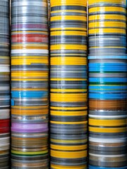 Poster - Window Sealing Tapes in Rolls Stacked Vertically in a Clean Background for Easy Access and Organization