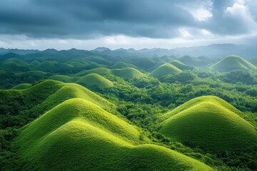 Aufkleber - Majestic green hills shrouded in mist during sunrise in a tropical landscape filled with lush vegetation