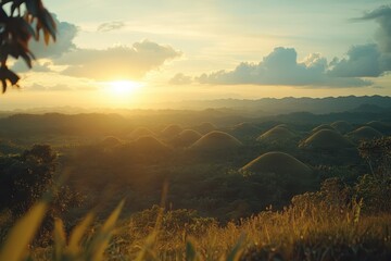 Poster - Sunset casts glowing light over rolling hills and valleys in a serene landscape filled with mist and dramatic clouds
