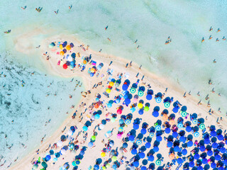 Wall Mural - summer vacation and rest. beach, people and umbrellas. top view from drone at the beach and azure se