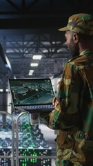 Poster - Vertical video Soldier in server room uses geospatial data to support evacuation during emergency operations. Military data center personnel in uniform coordinating disaster response logistics using