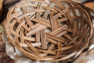 Poster - A handcrafted wicker basket showcases a detailed woven pattern, ideal for storage or decorative displays. The texture and warm tones add a rustic touch to any setting and d?cor.