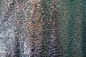 Poster - Abstract silver background featuring a wrinkled, metallic texture. The high contrast creates an intriguing play of light and shadow across the irregular surface, adding visual interest.
