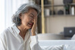 © Art_Photo - Elderly asian woman touching face while suffering from eye strain with discomfort, dry eyes or possible vision related illness, glaucoma, expressing symptoms of chronic eye condition at home