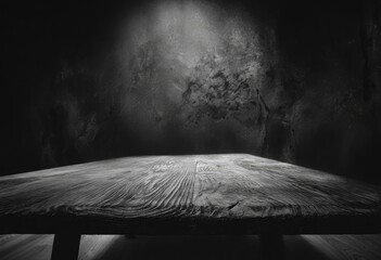 Wall Mural - a rustic wooden plank table sits in a dark room, illuminated by a spotlight against a textured wall