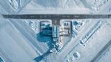 Aerial view of an air terminal in a snowy landscape arctic region drone photography winter environment