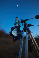 Wall Mural - astronomy telescope coupled with a smartphone for capturing moon, stars, planets and other celestial
