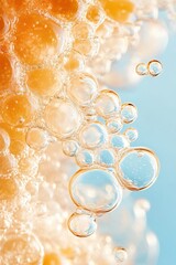 Poster - Close up of golden bubbles. Liquid spheres with reflections on light blue background. Refreshing craft beverages texture with foam.