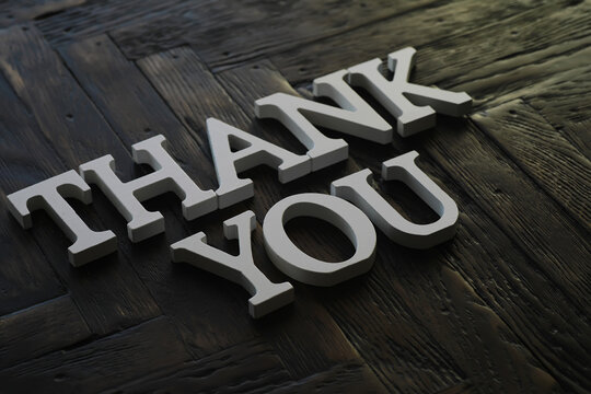 Thank You Message in 3D Letters on Dark Wooden Surface