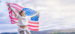 © Vladimir Razgulyaev - Celebrating independence day us in 4th july with a young american woman waving the flag, Freedom and copy space right place outdoors