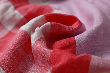 Aufkleber - Textiles in vibrant colors with intricate patterns on display at a local artisan market in the afternoon sunlight